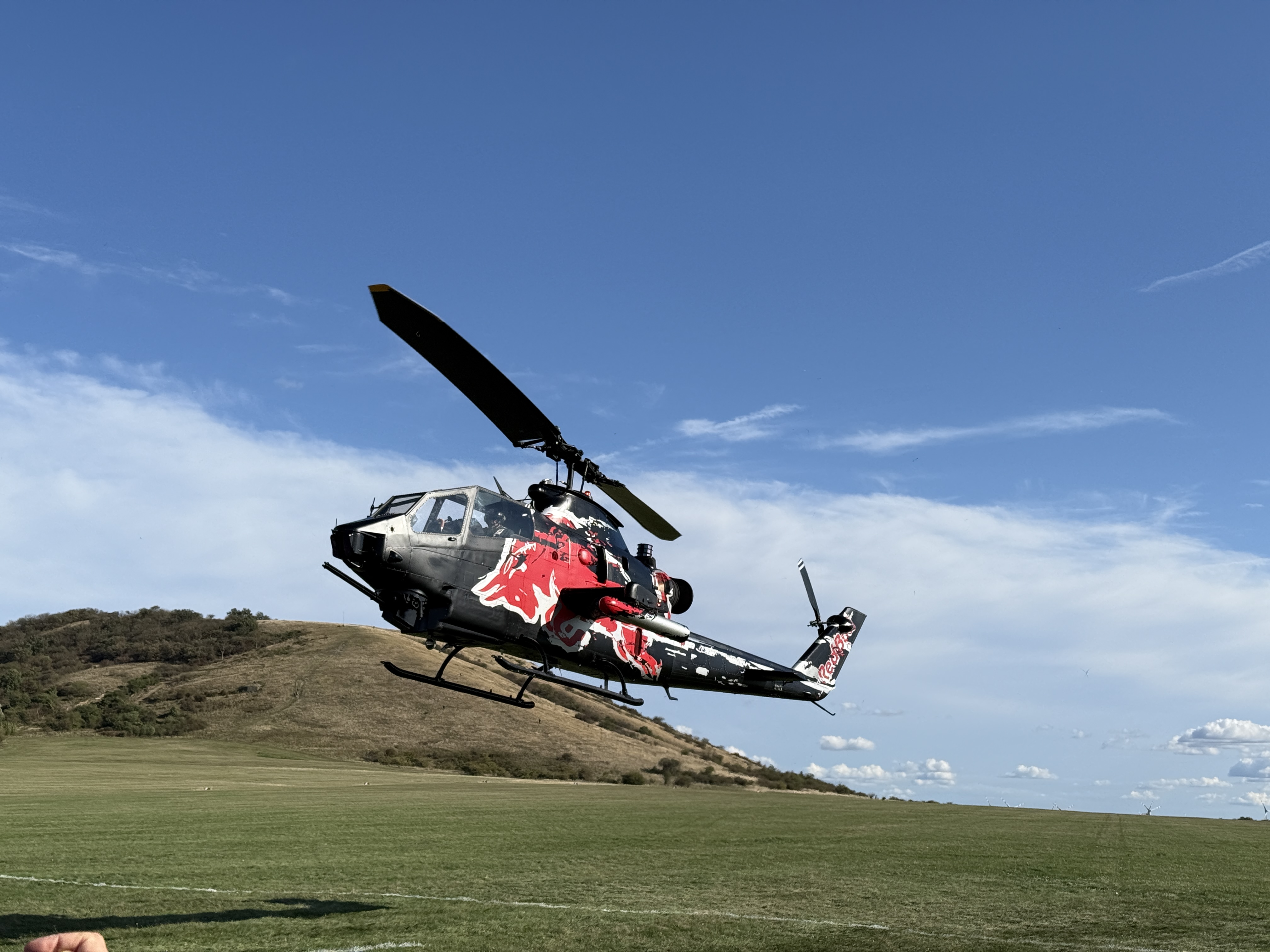 helicopter hovering over field
