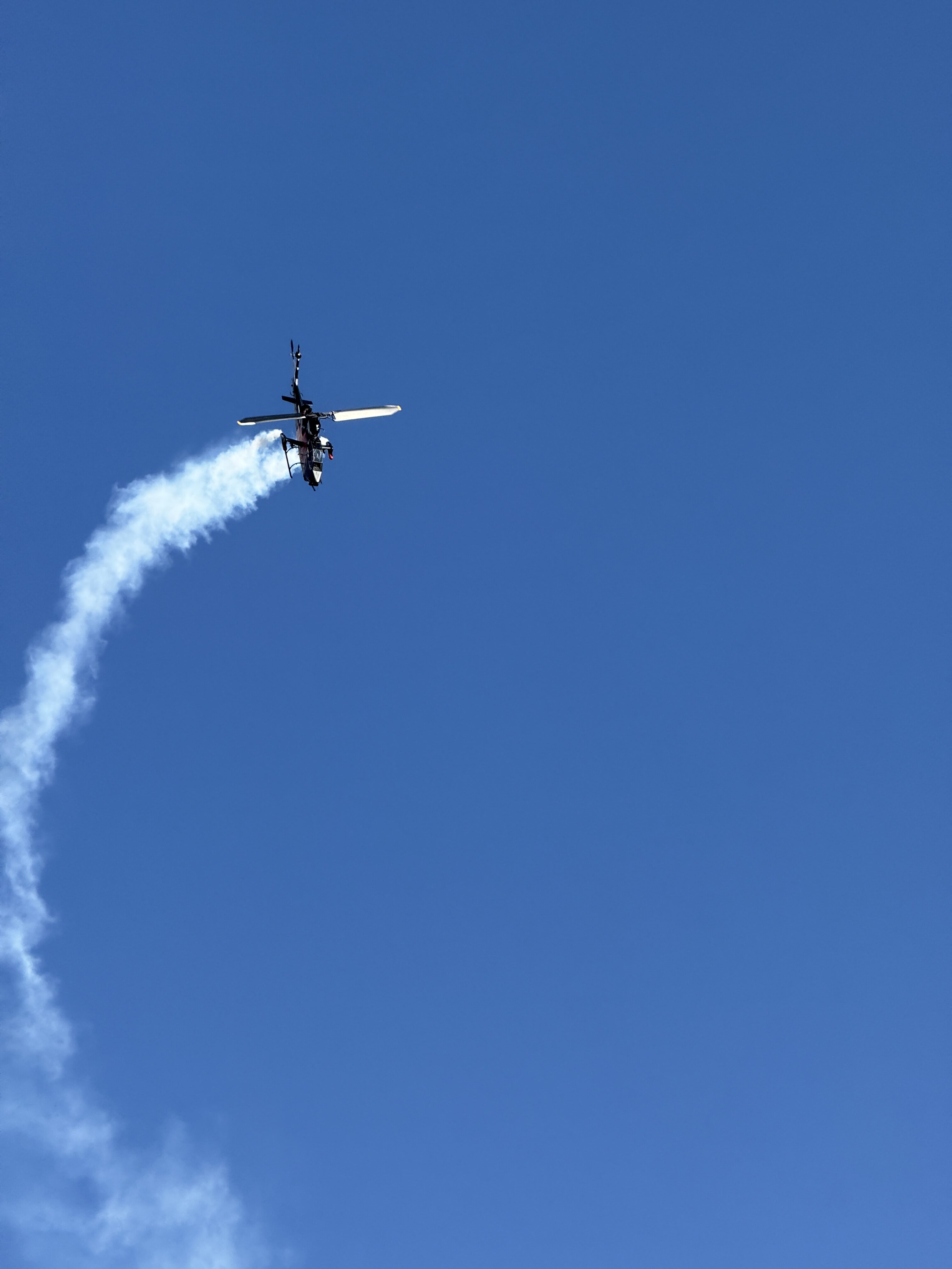 helicopter looping smoke trail