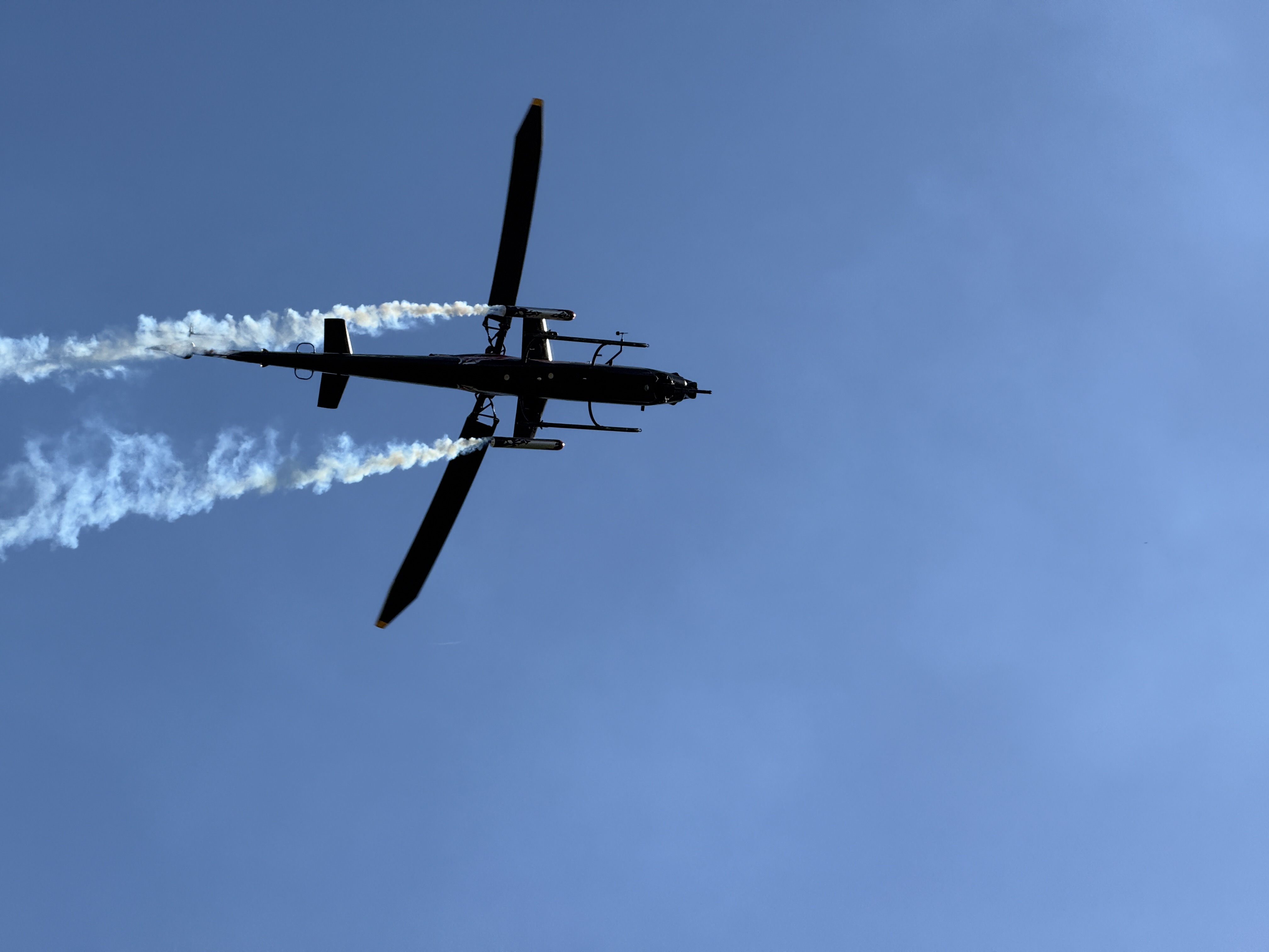 helicopter silhouette smoke trail