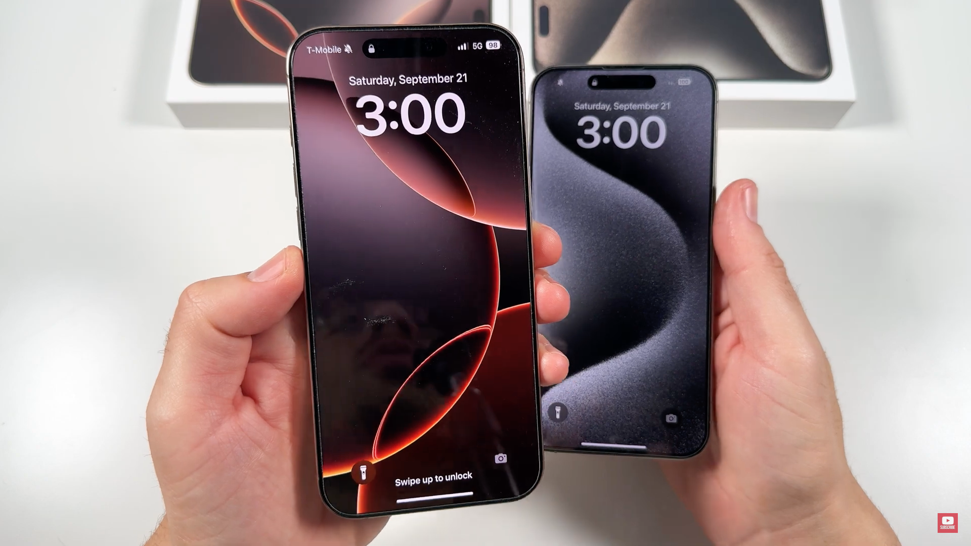 holding two smartphones