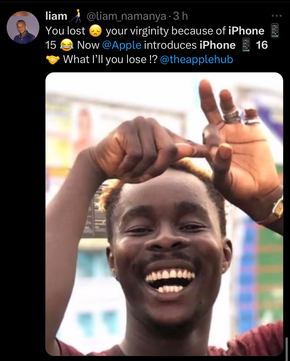 man smiling pointing up