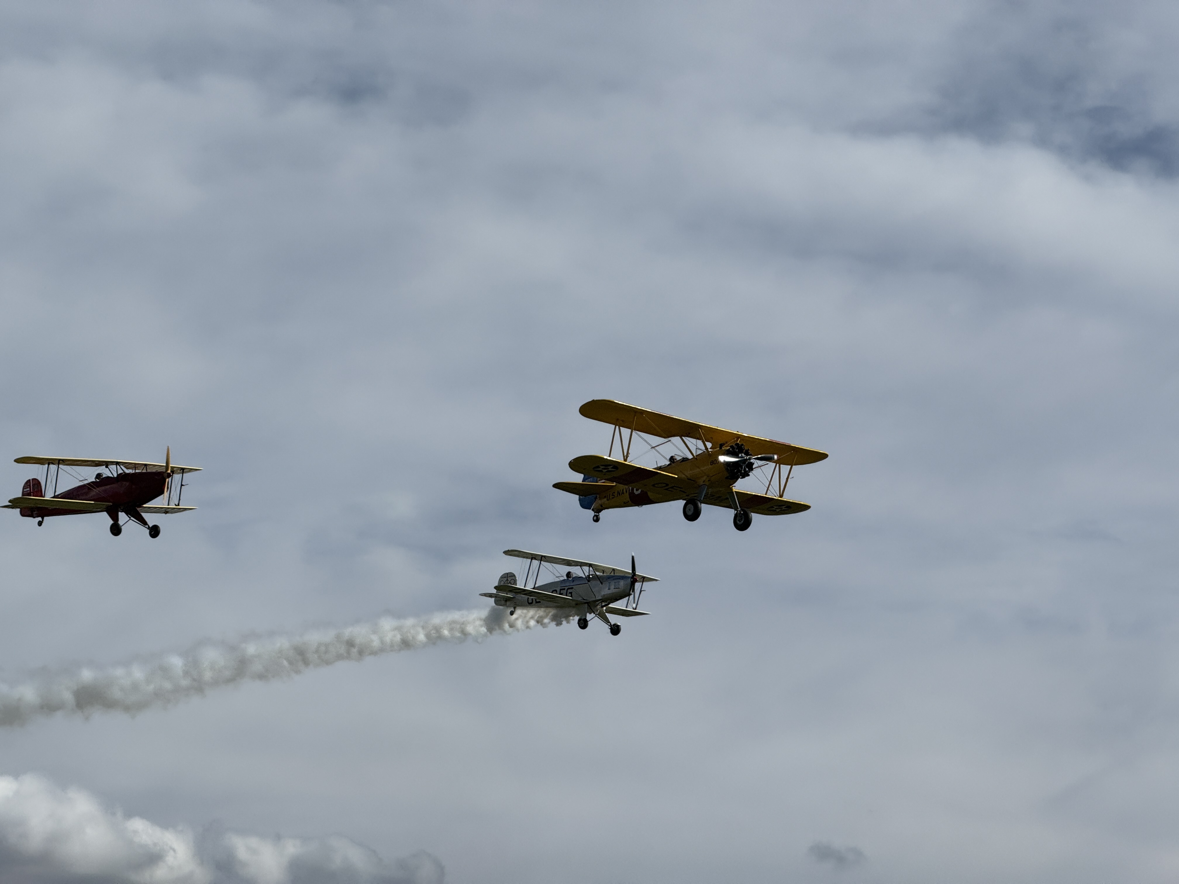 three biplanes in sky