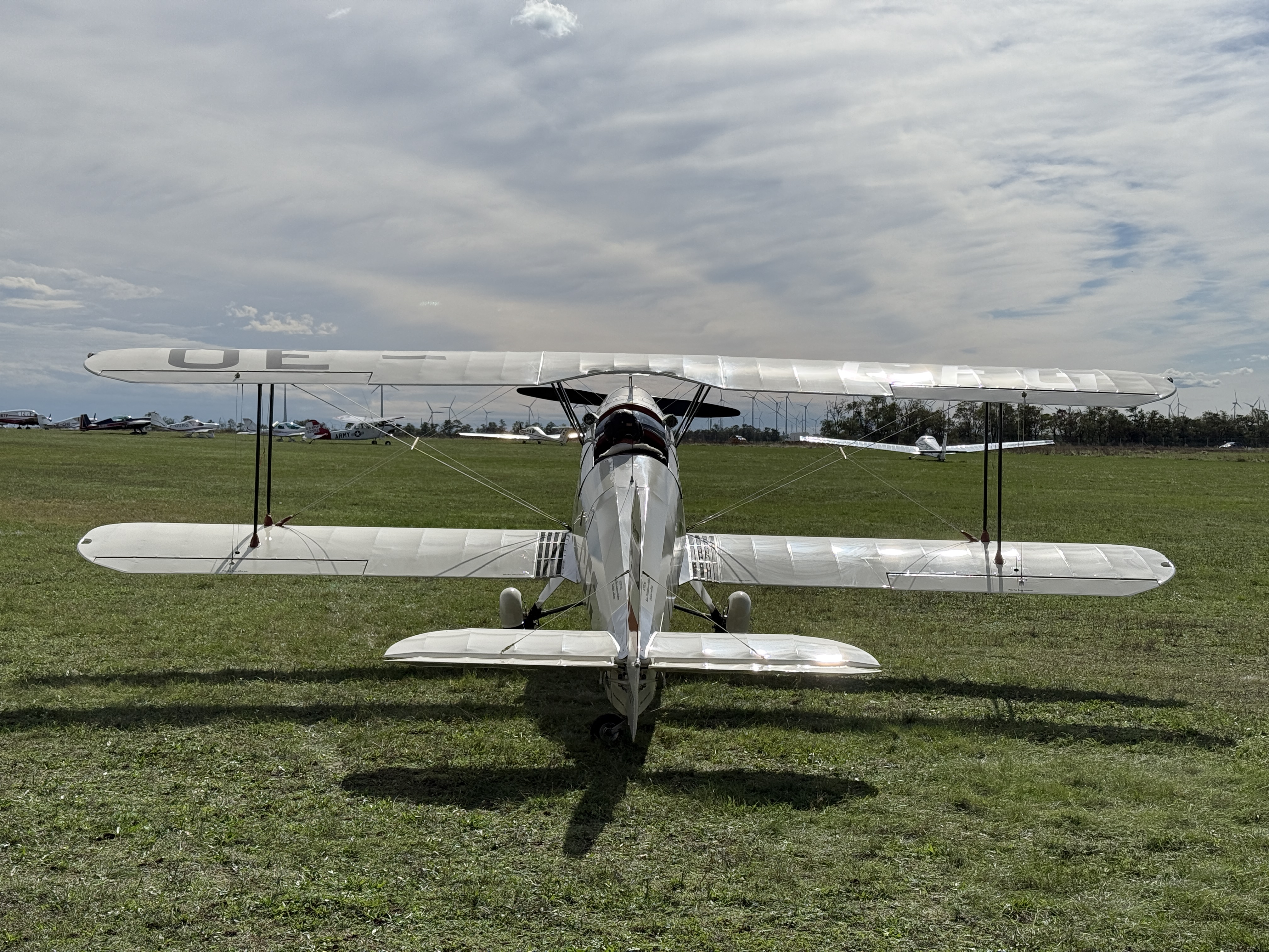 white biplane rear view