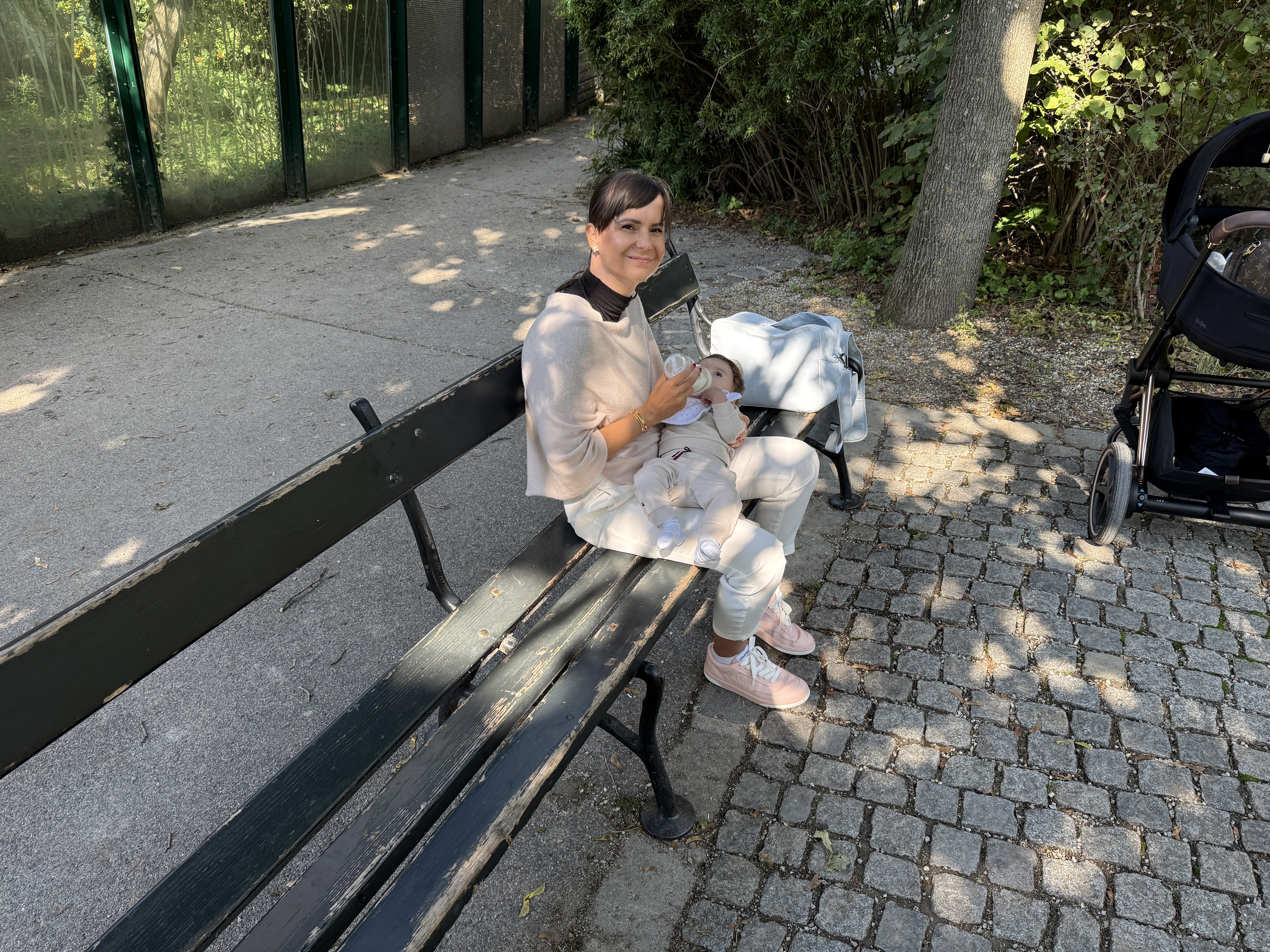 woman sitting on bench with baby