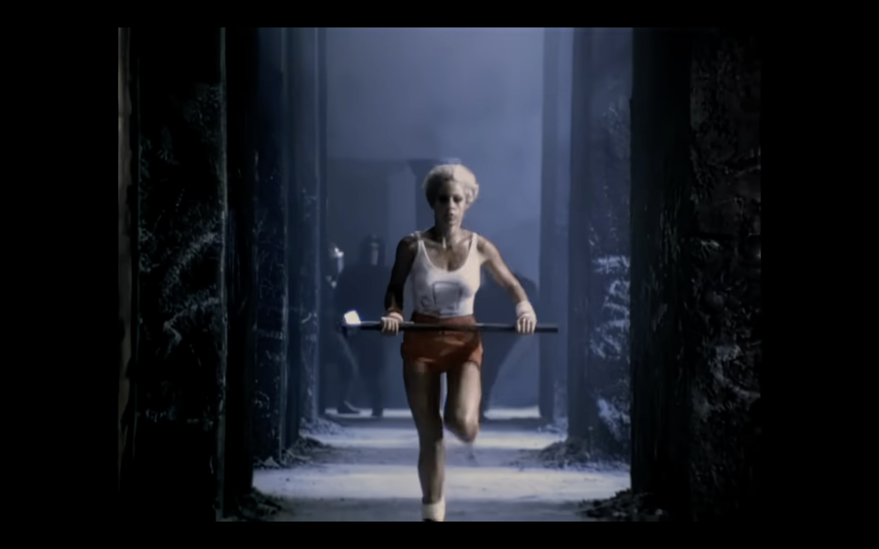 athlete running with hammer