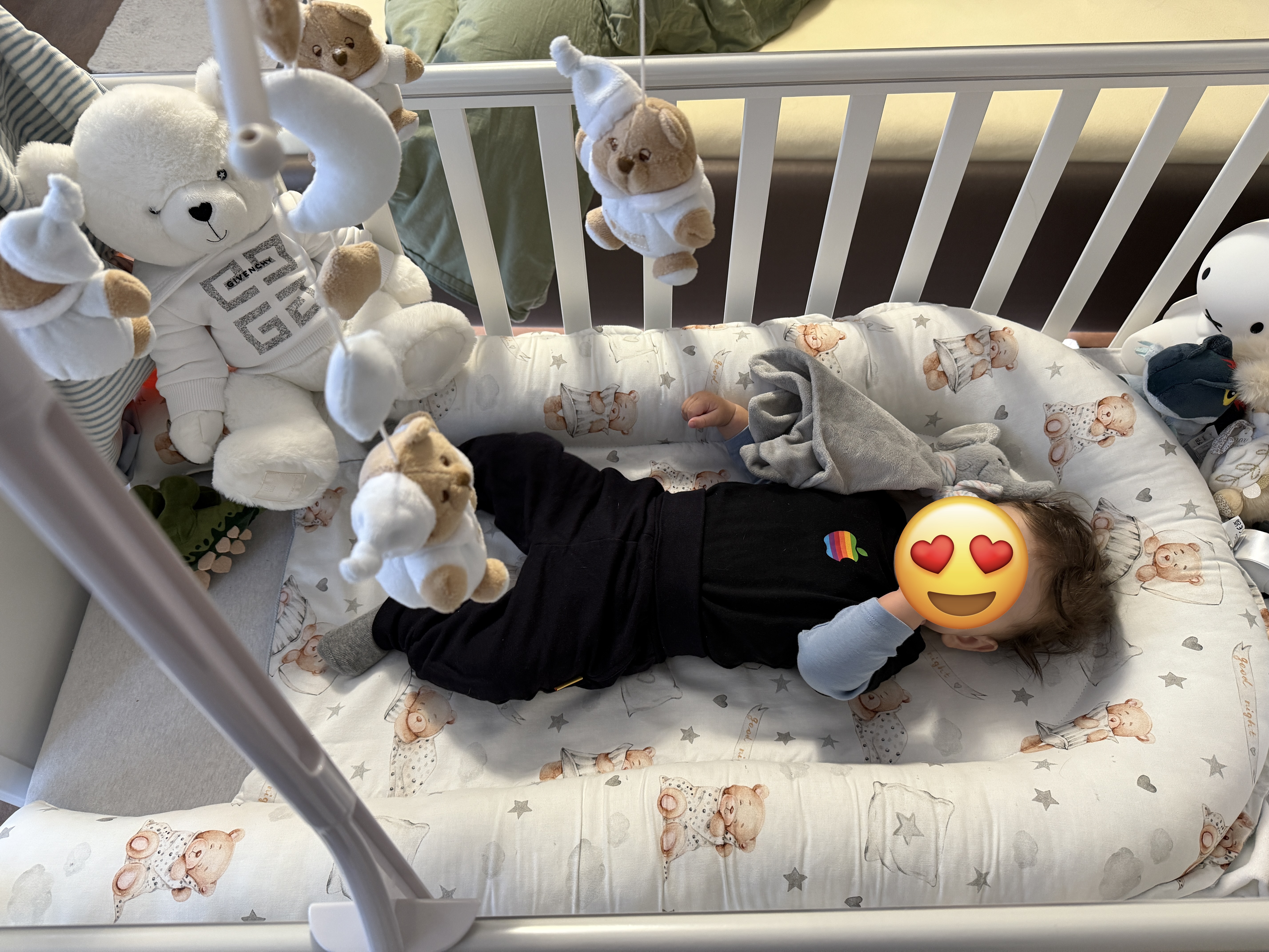 baby lying sideways in crib