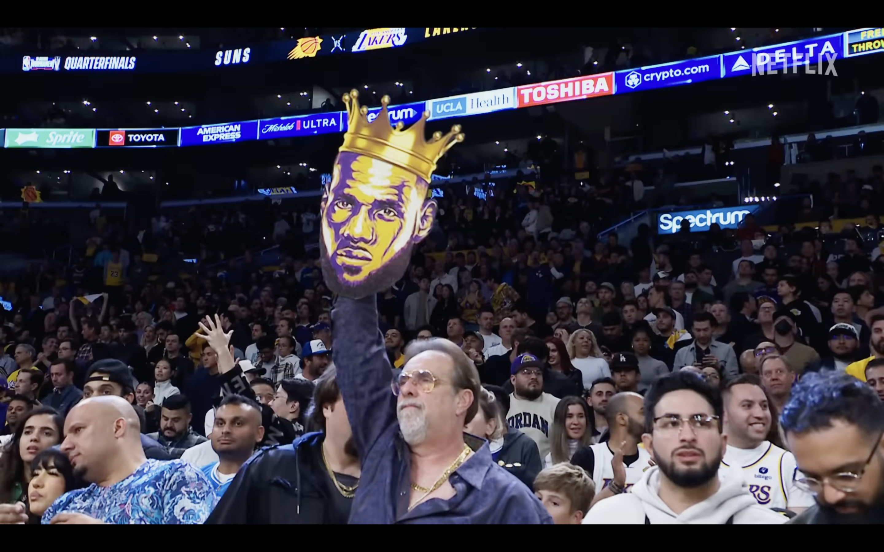 basketball crowd holding sign