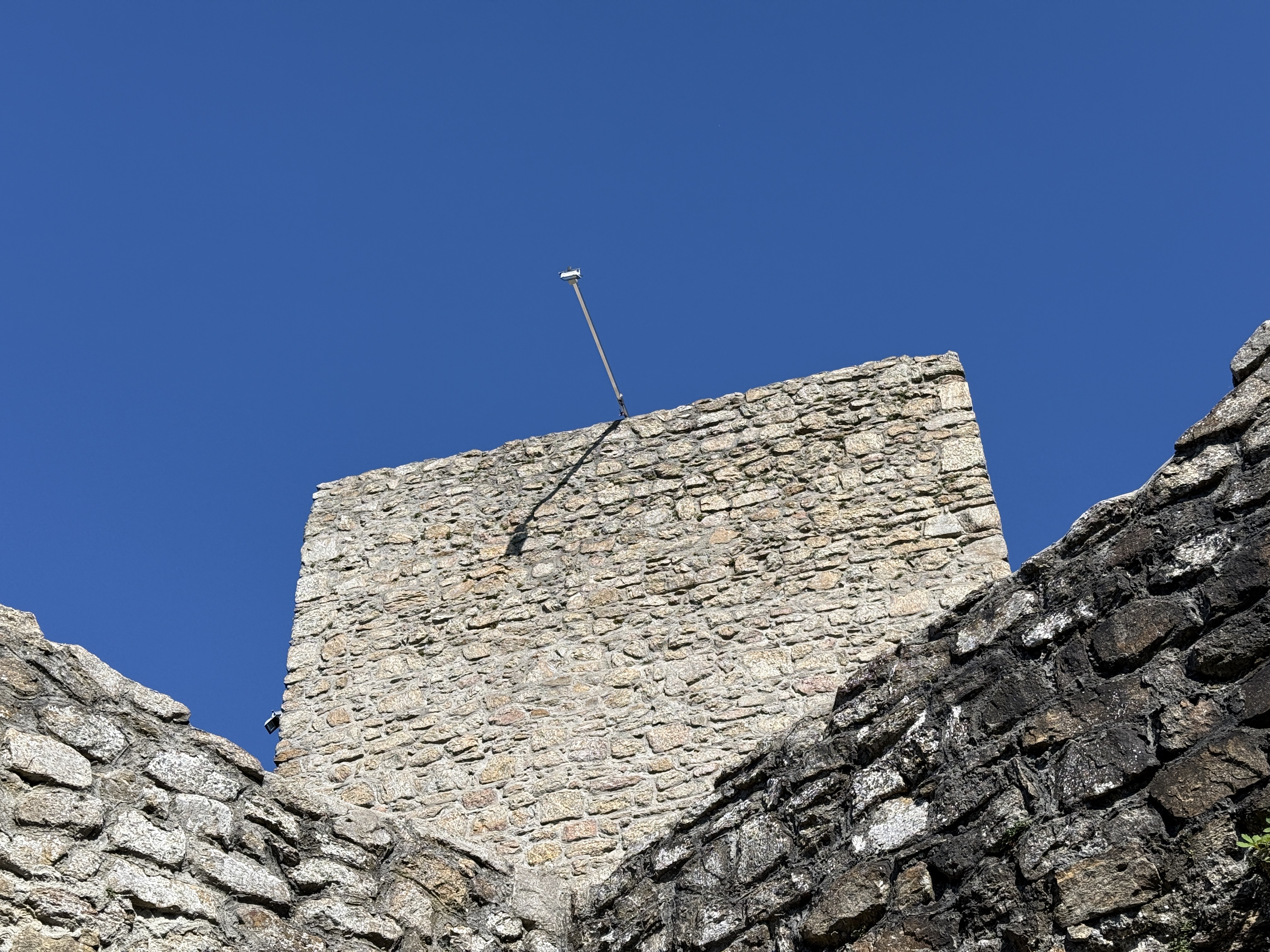 closeup antenna on stone tower
