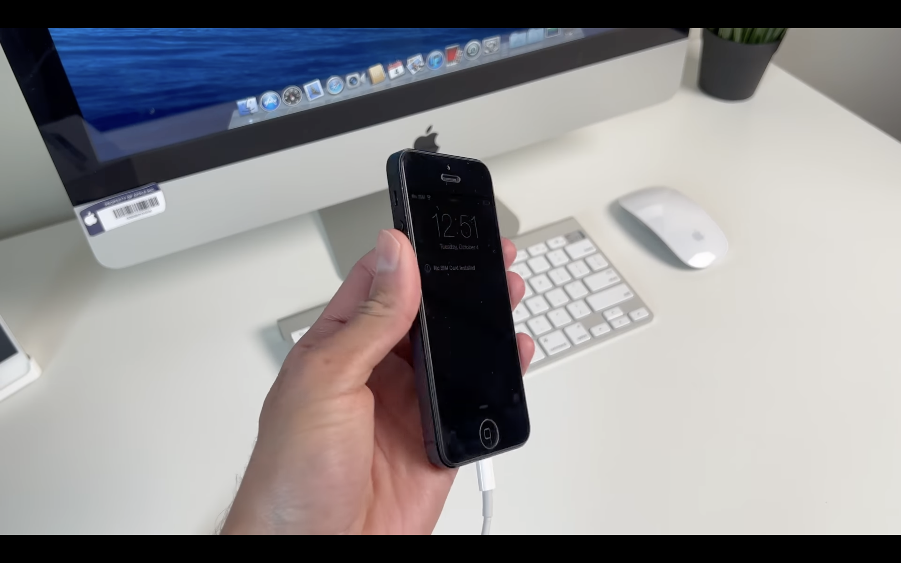 hand holding iphone locked screen