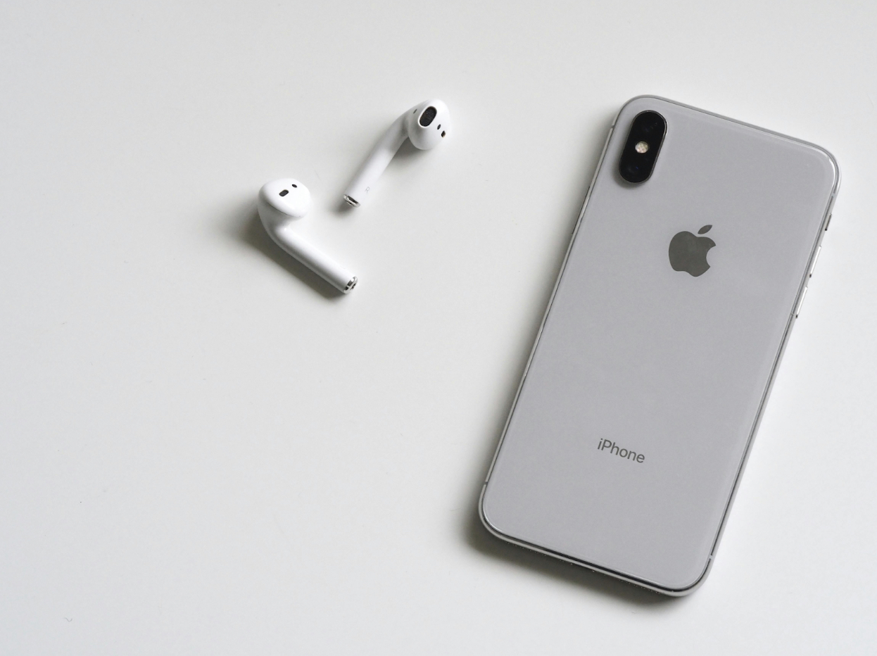 iphone and airpods on table