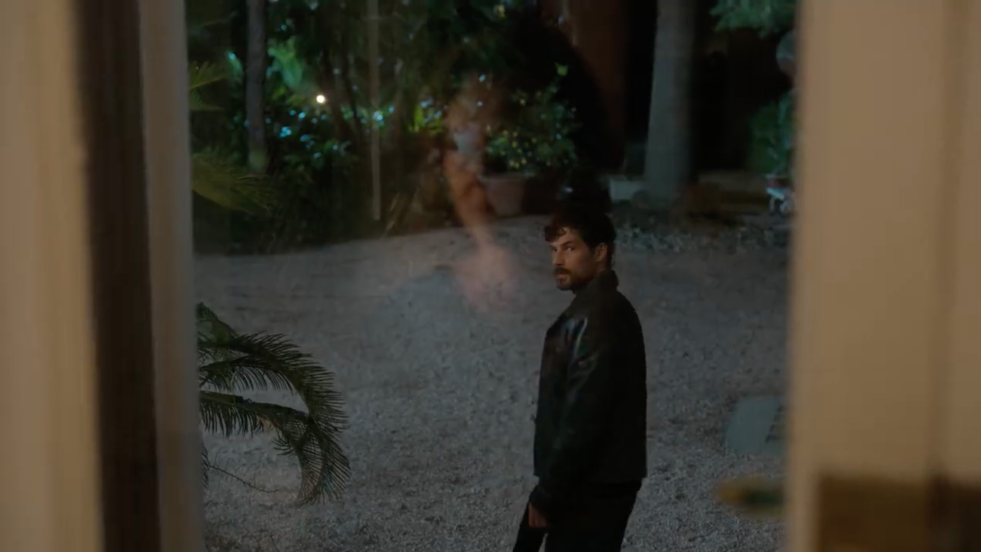 man outside window night