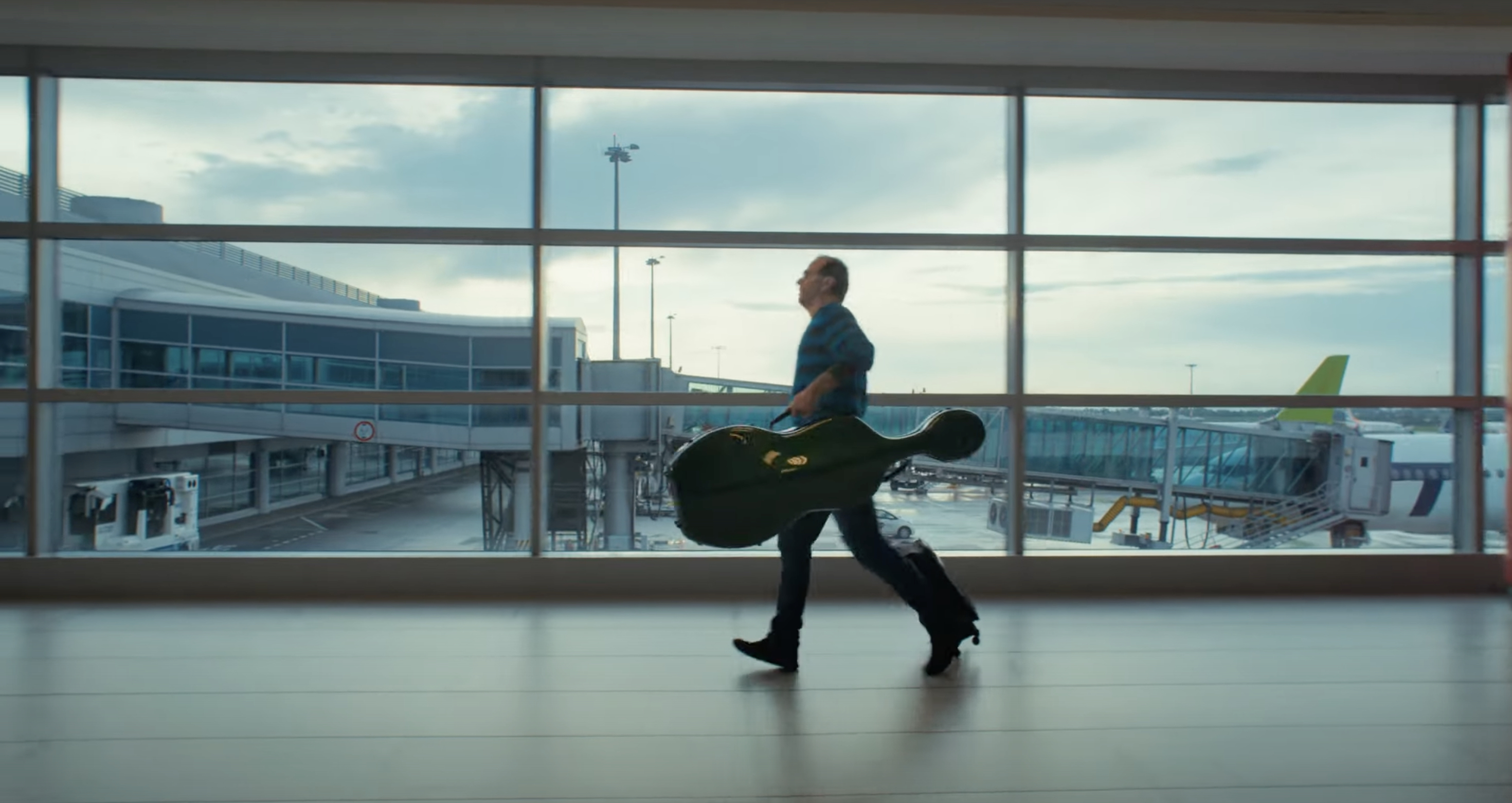 man walking airport terminal