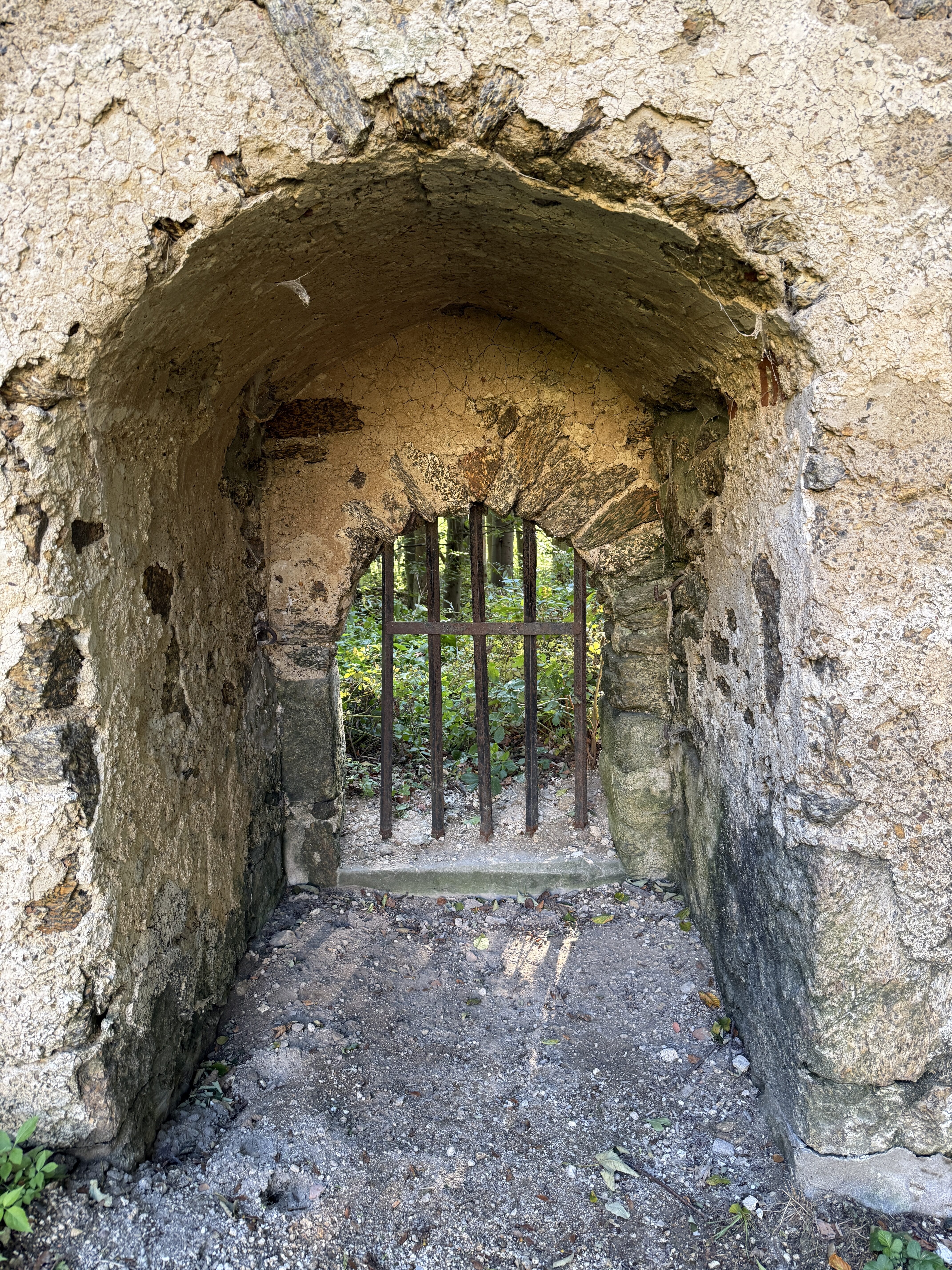 stone archway with bars