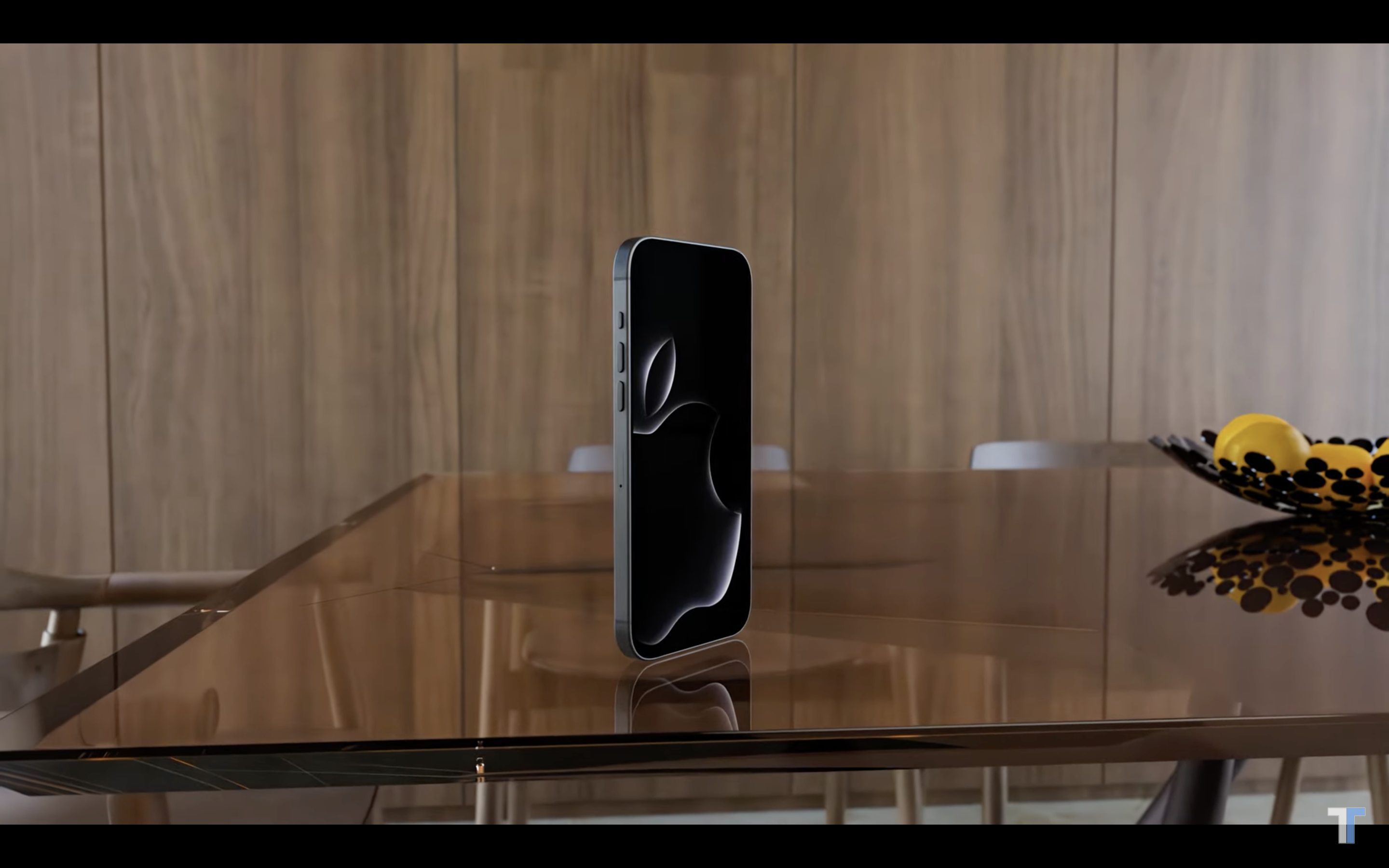 black smartphone on glass table