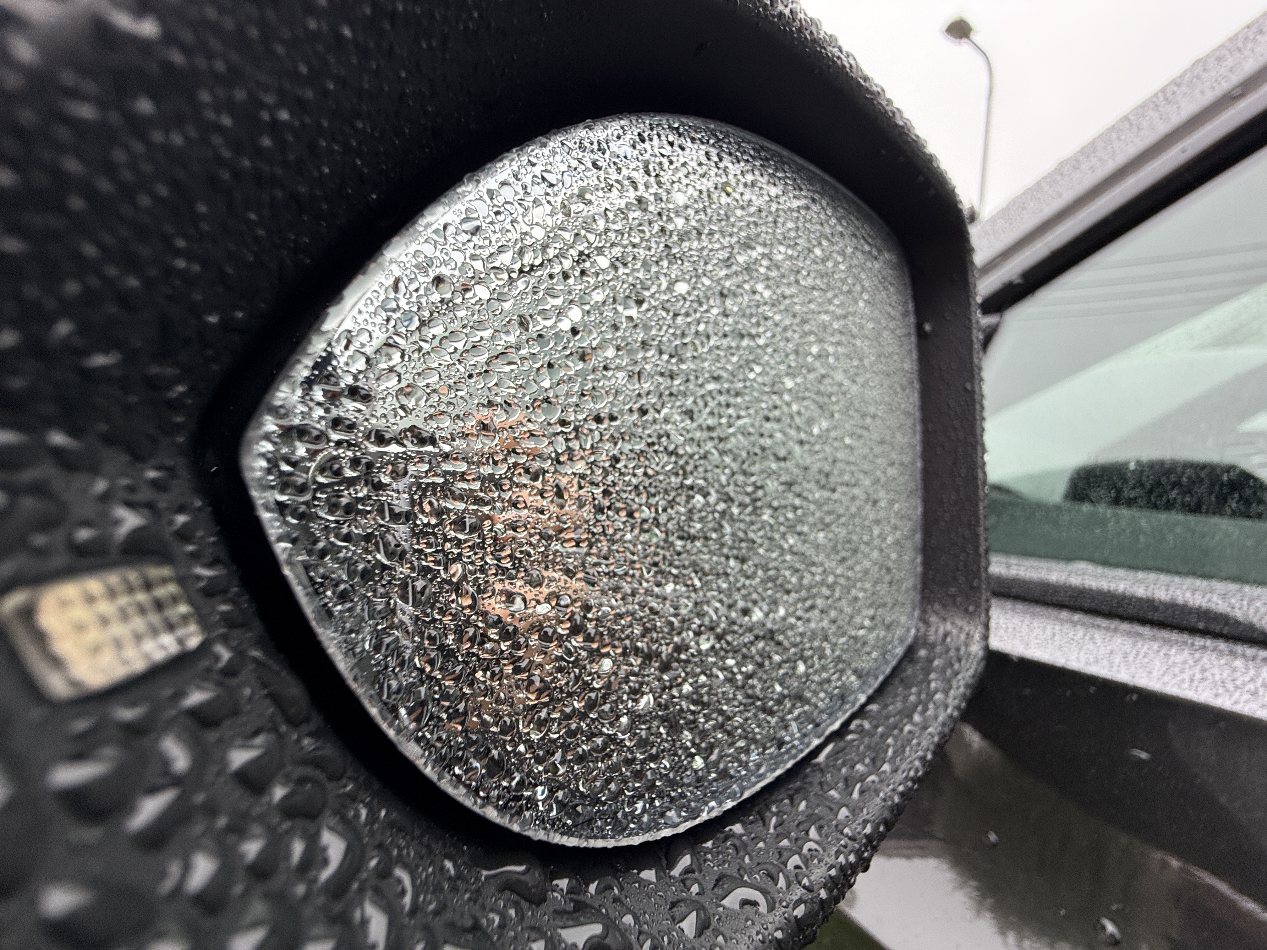car mirror with raindrops