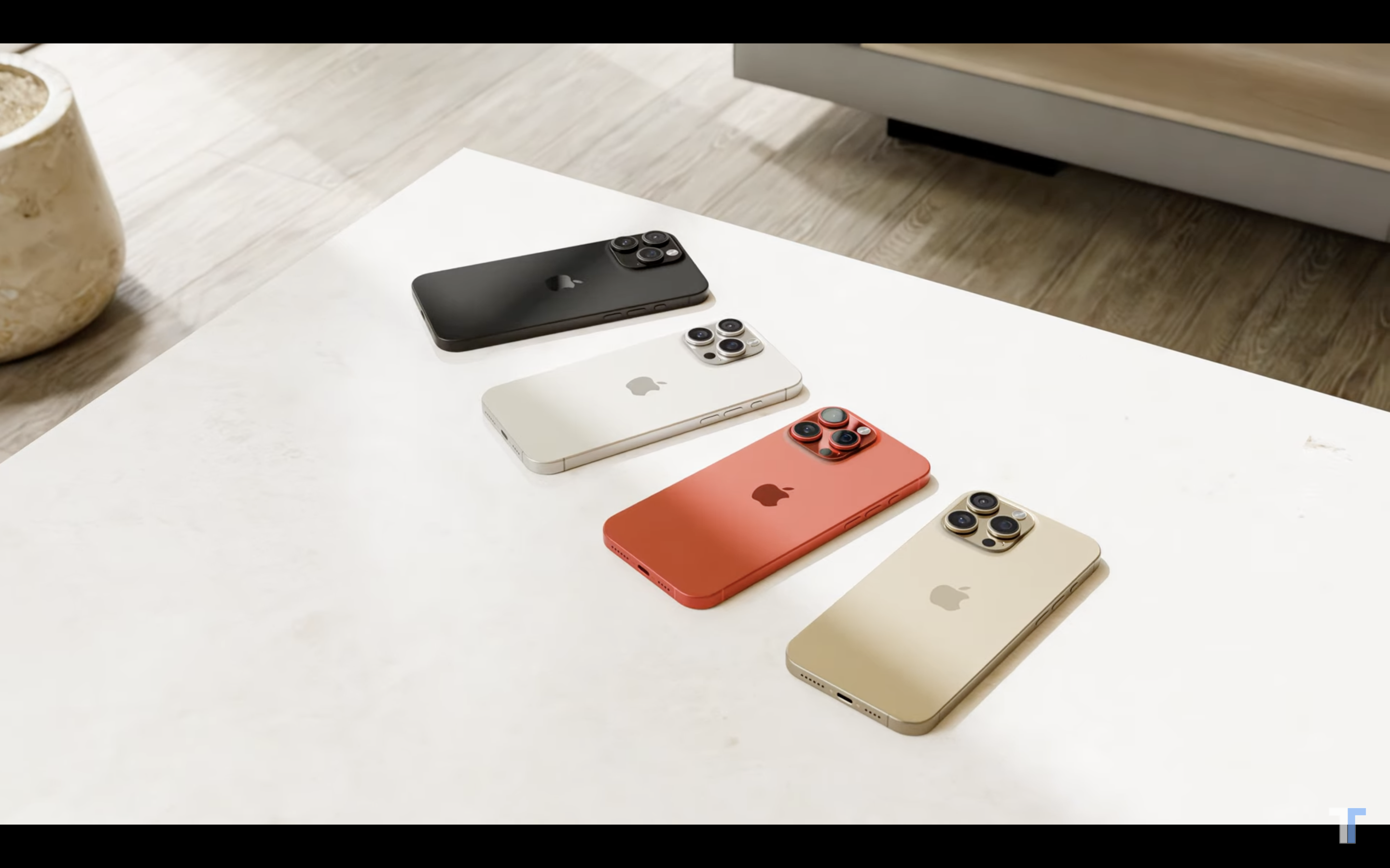 four smartphones on white table