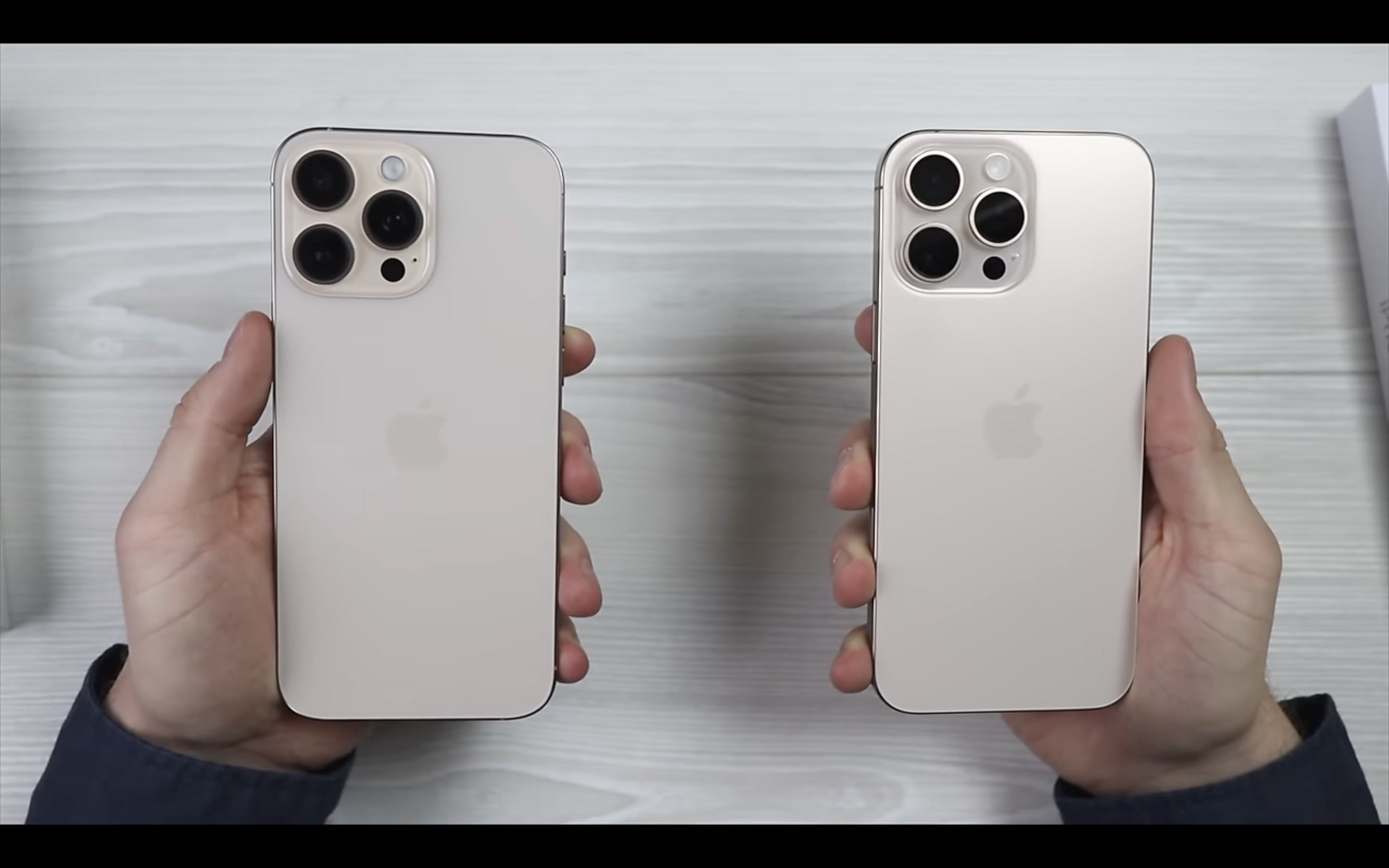 holding two smartphones