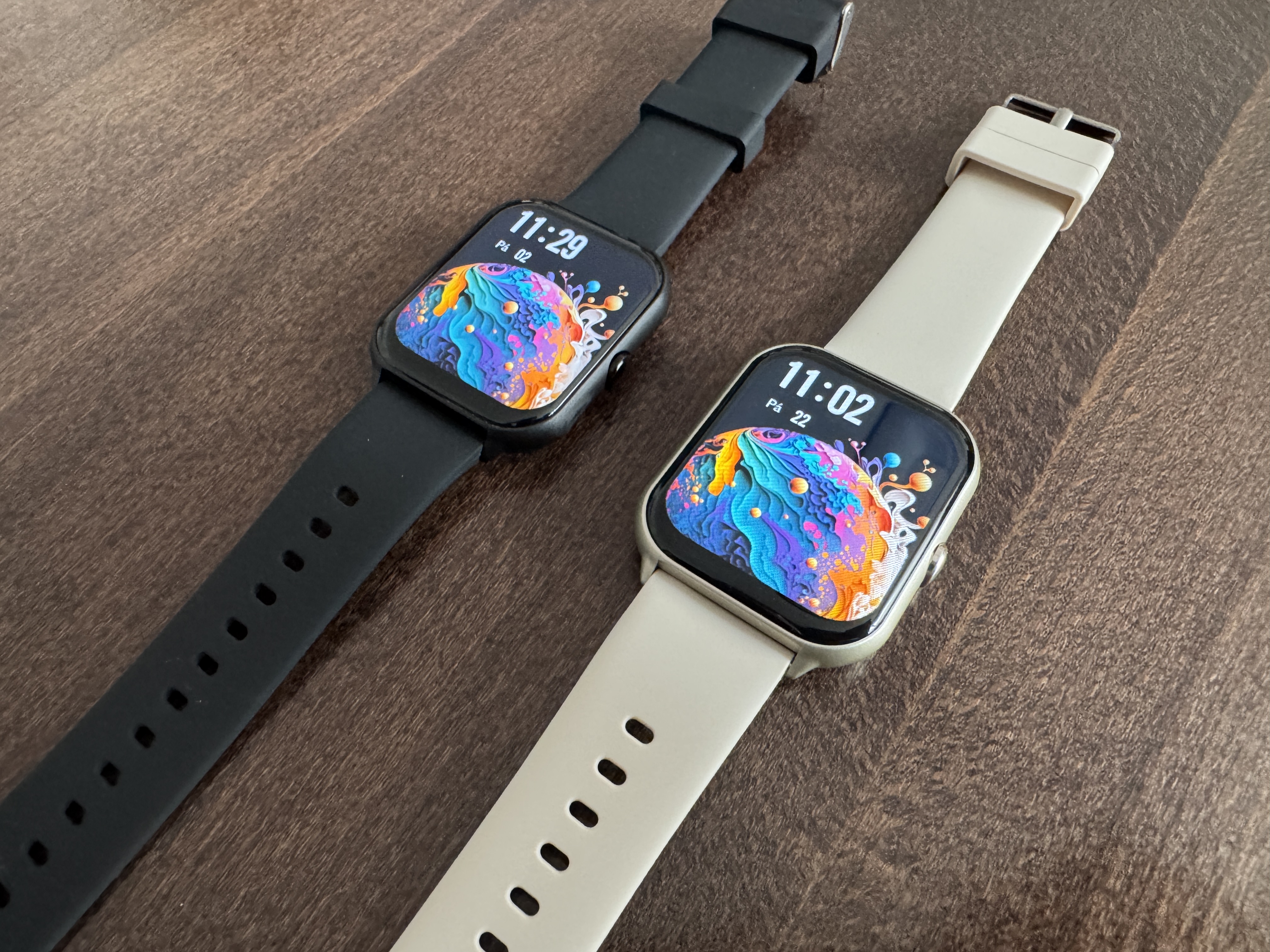 smartwatches on wooden table