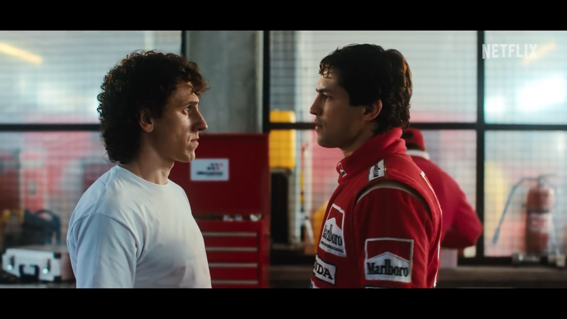 two men talking in garage