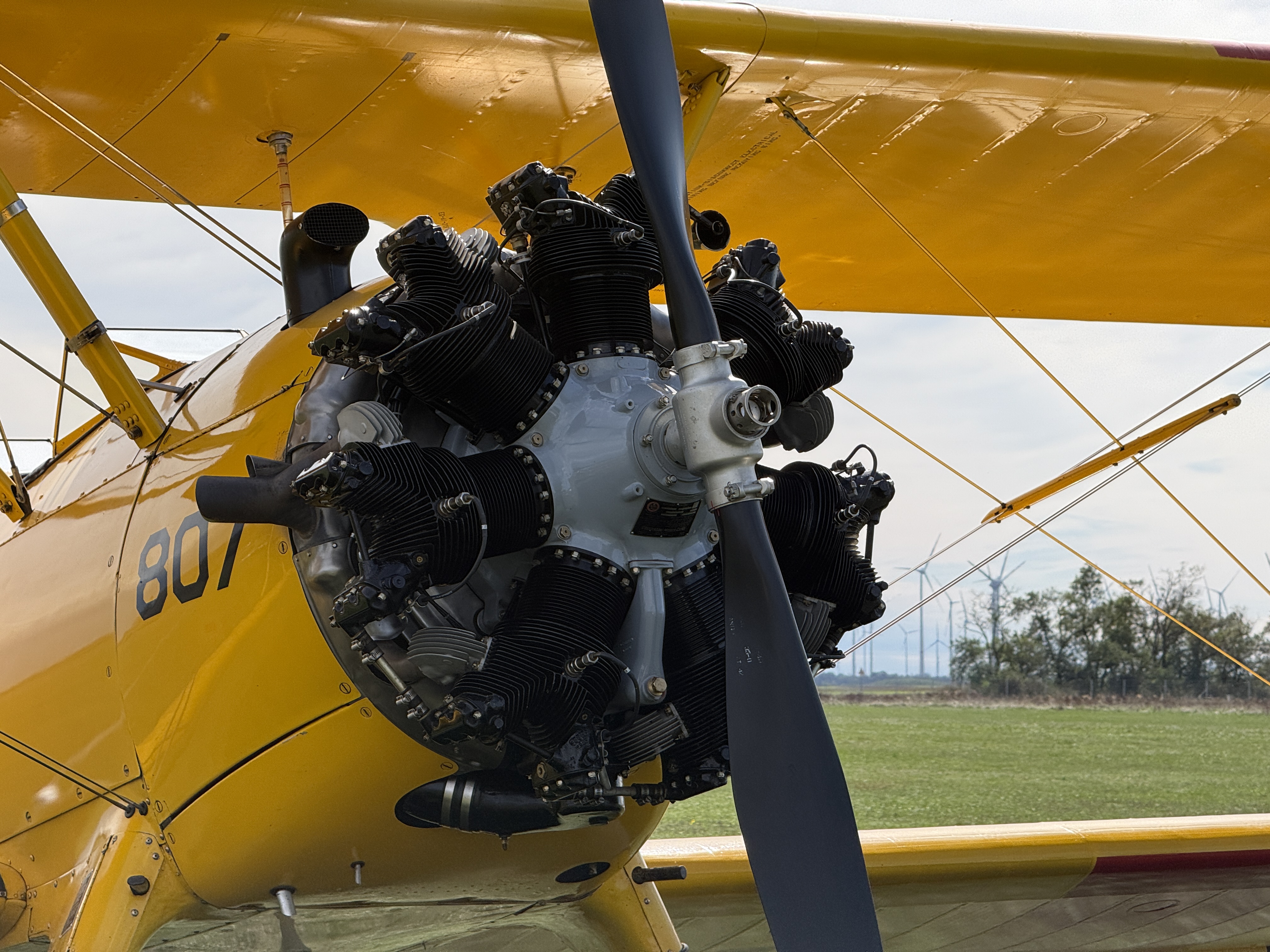 yellow biplane engine closeup