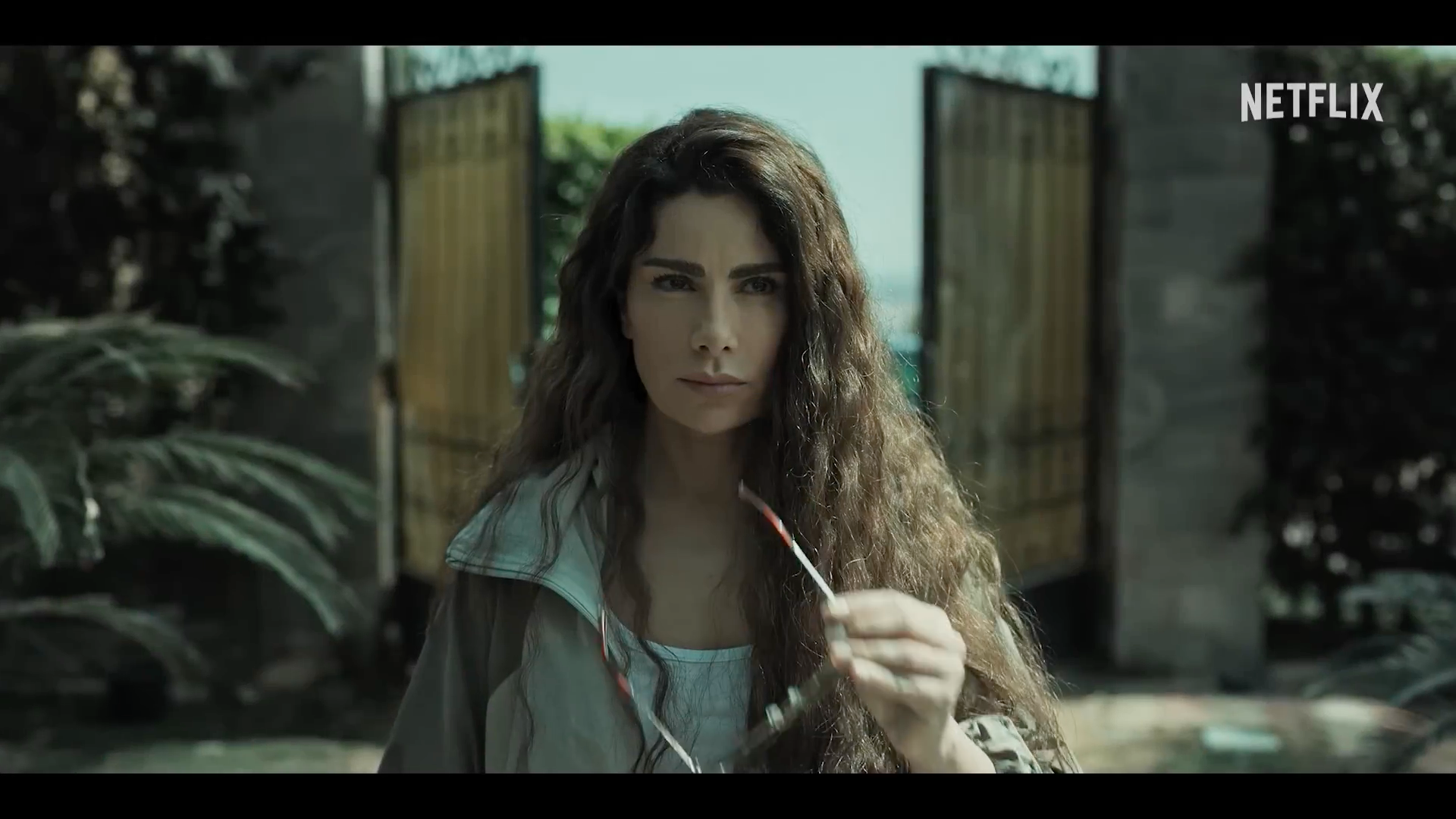 dramatic scene with woman and gate