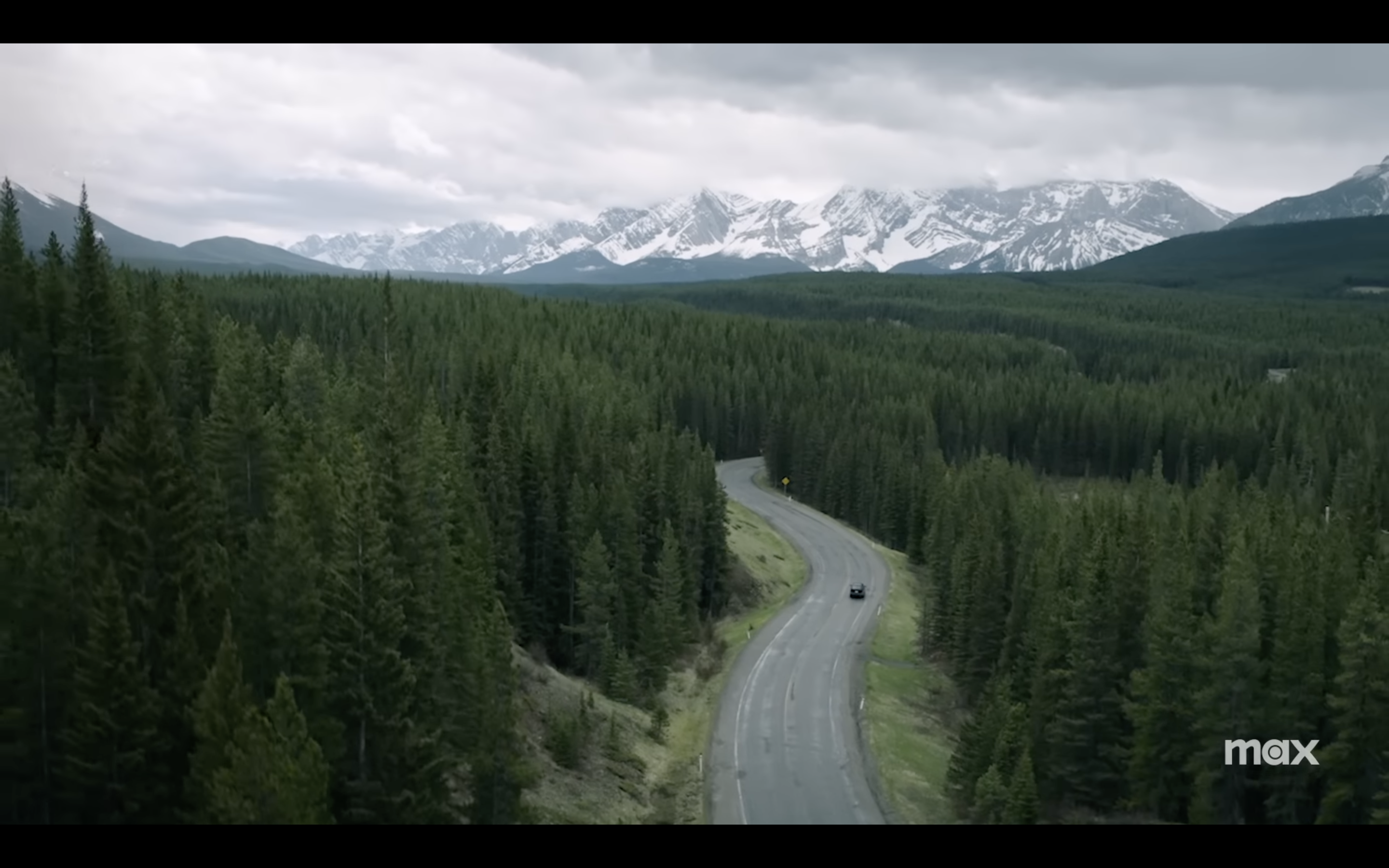 road through forest and mountains