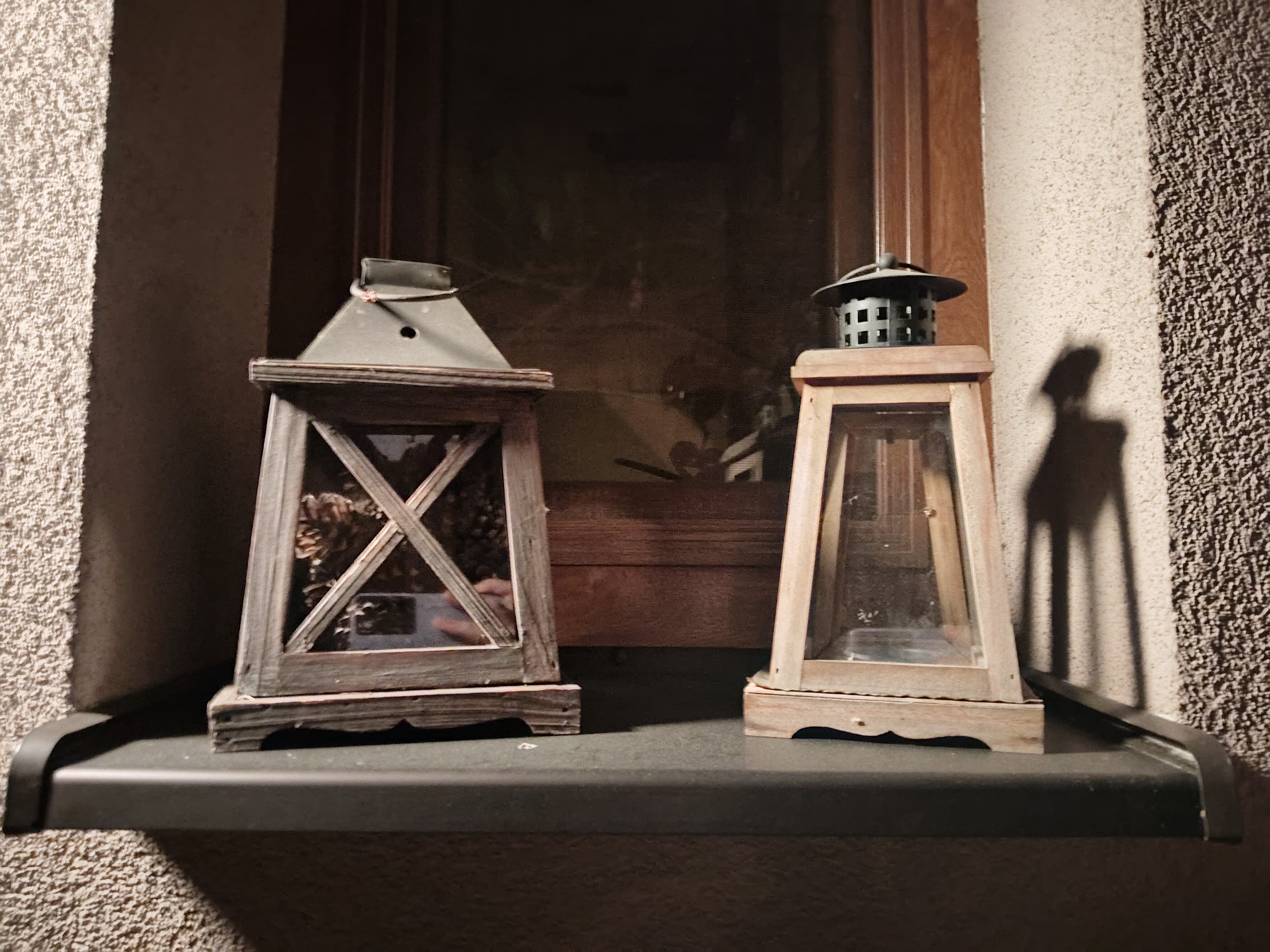 wooden lanterns on shelf