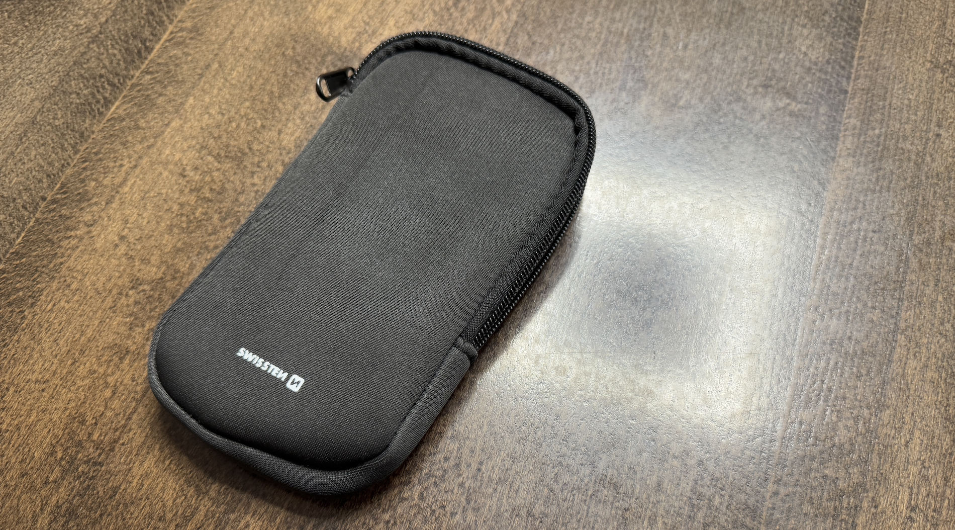 black pouch on wooden table