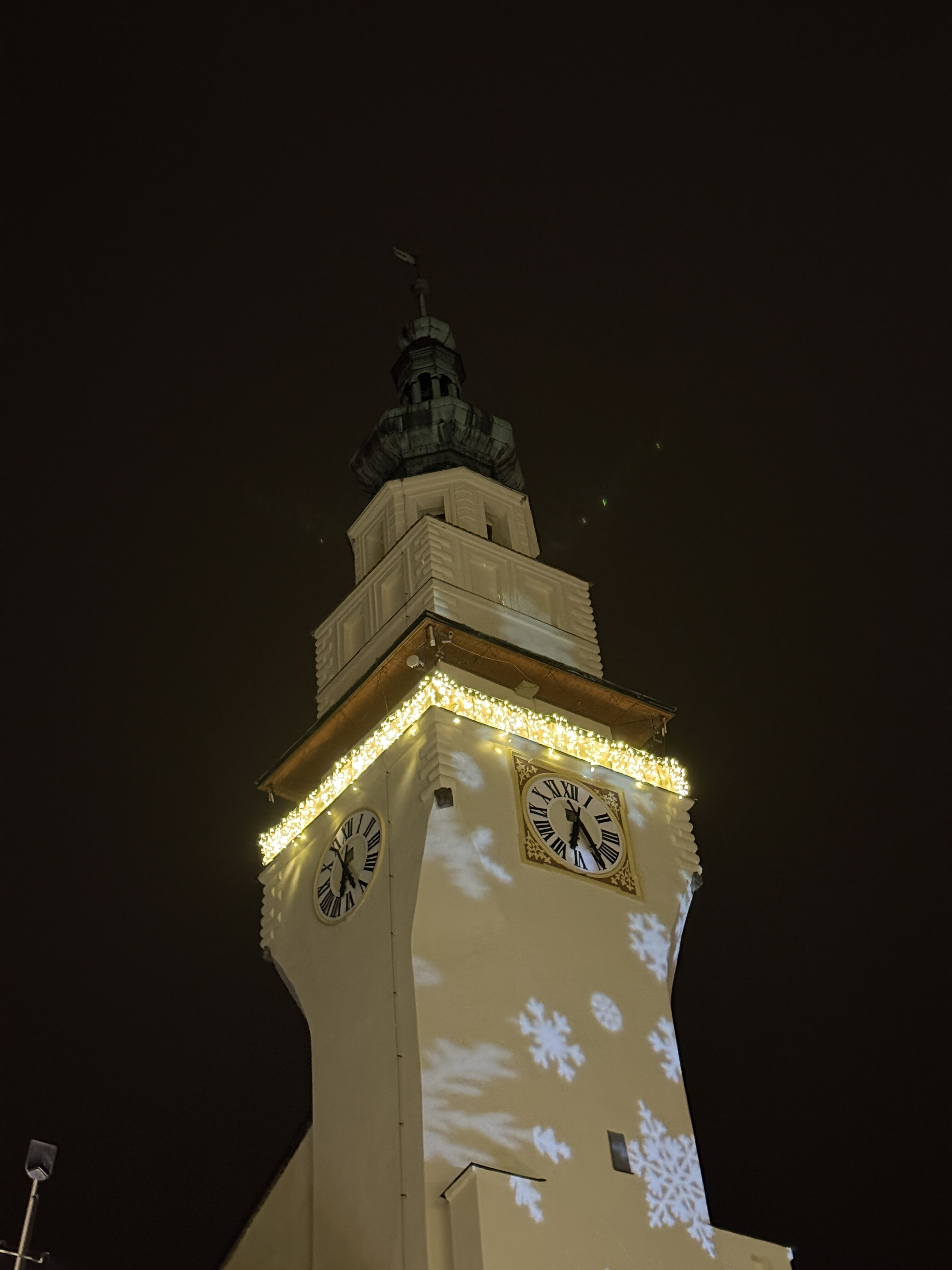 clock tower night snowflakes