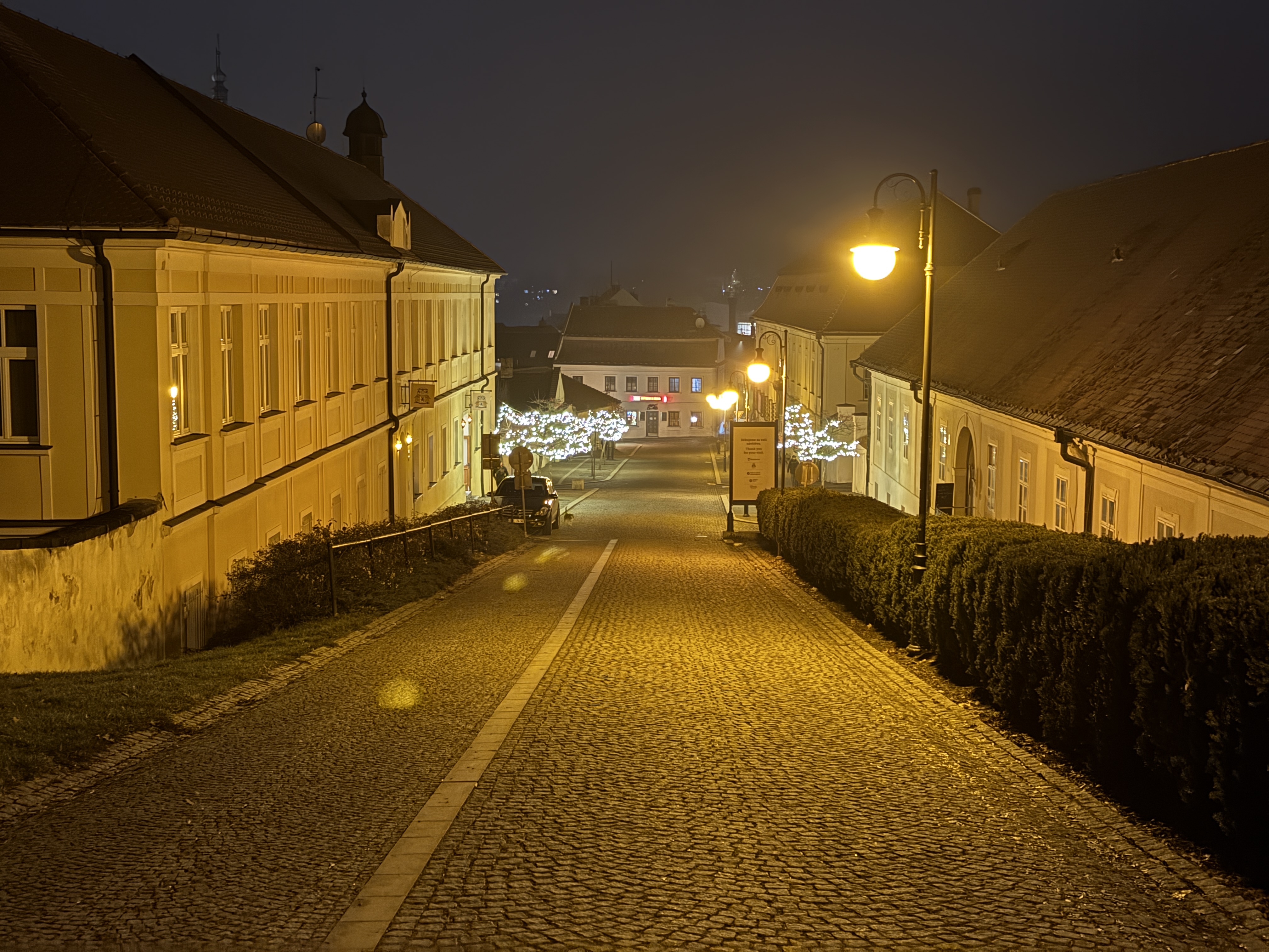 cobblestone street night lights