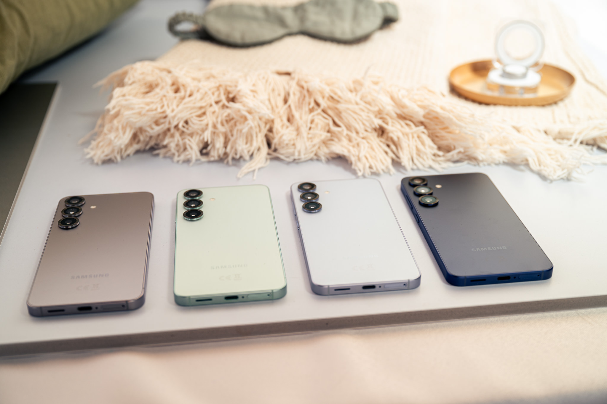 four smartphones on table