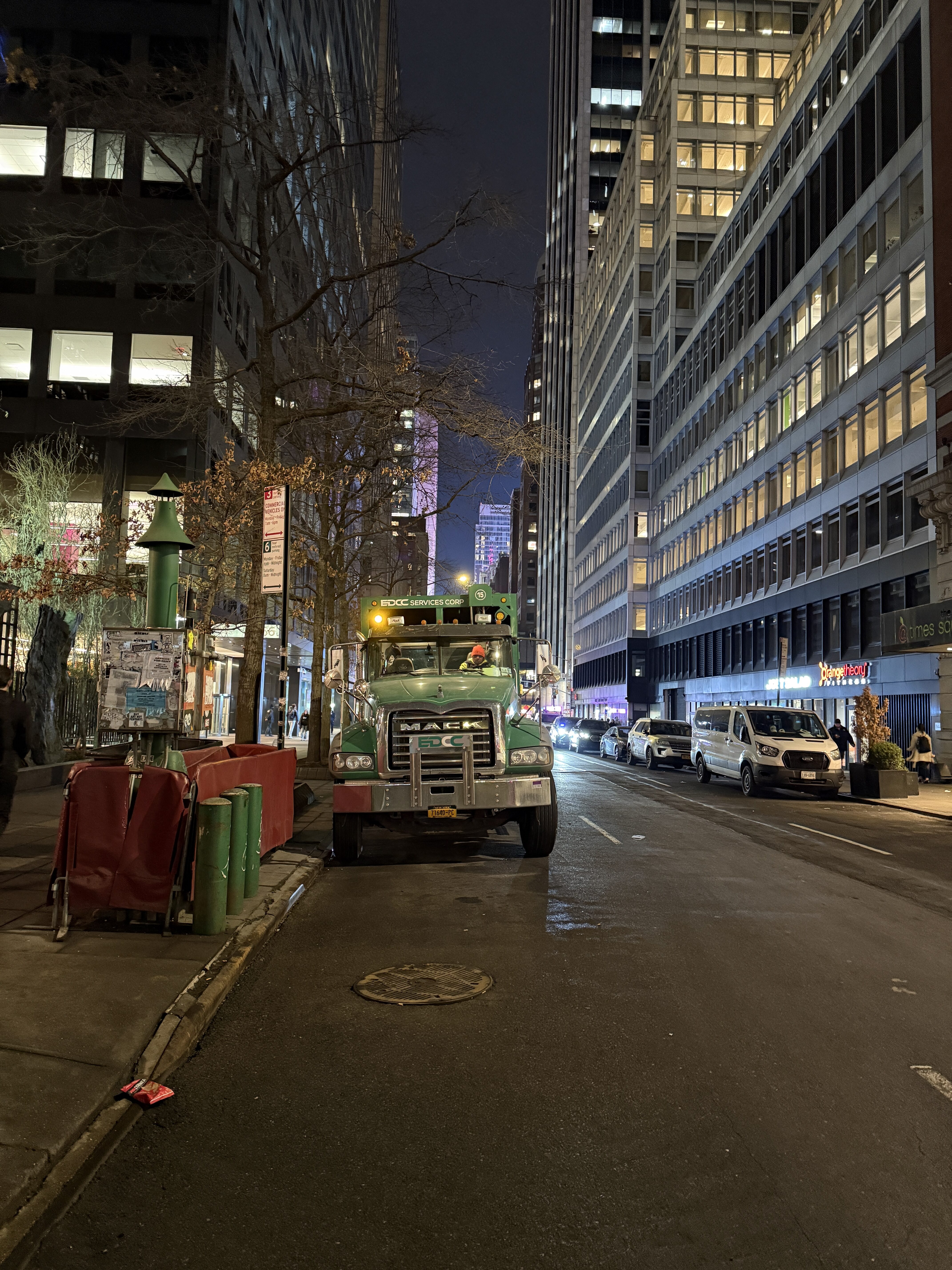 Classic Green Mack Truck in NYC at Night – Urban Street Scene