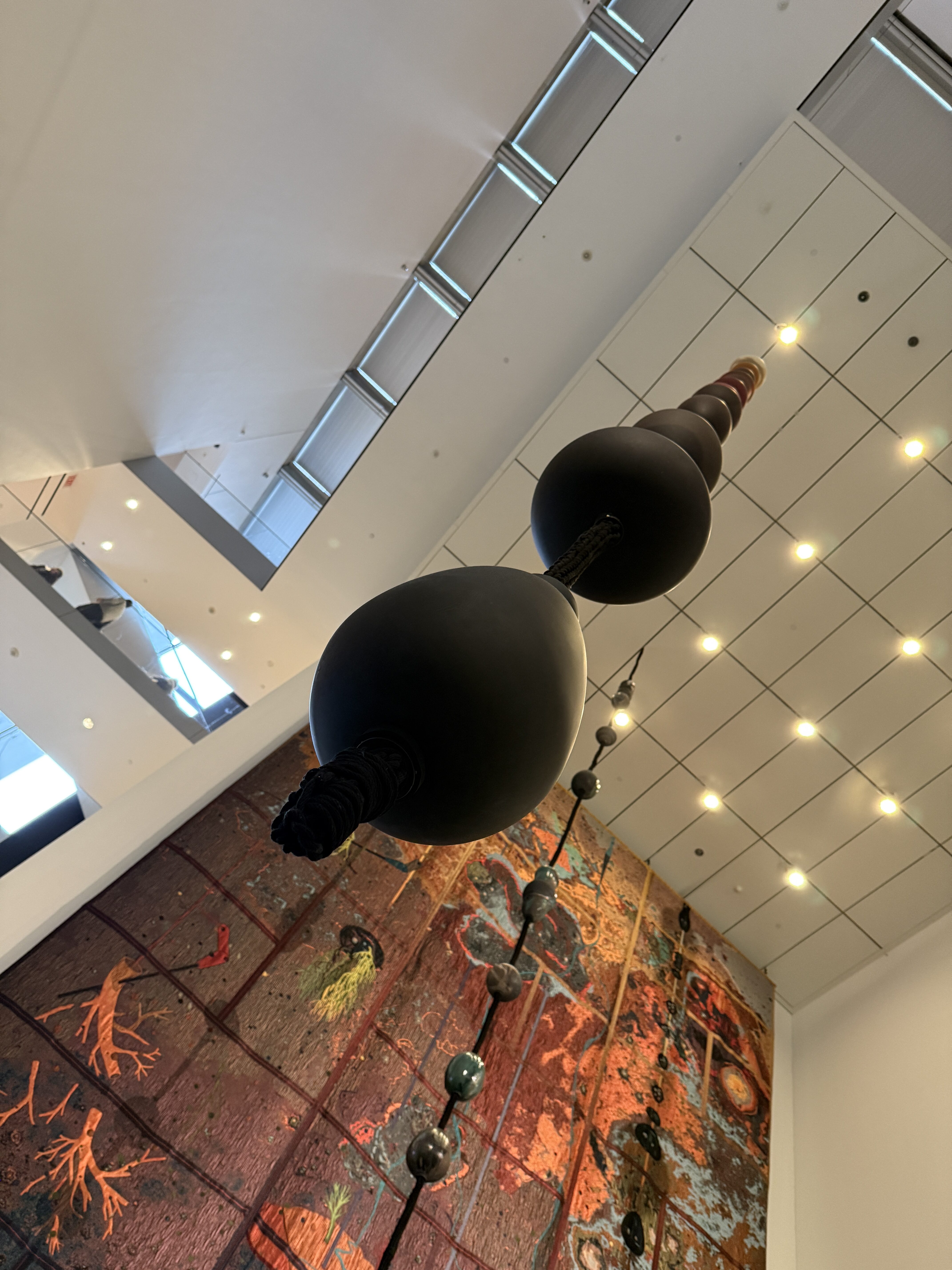 Modern Art Installation – Suspended Ceramic Sculpture with Cosmic Mural in NYC Museum