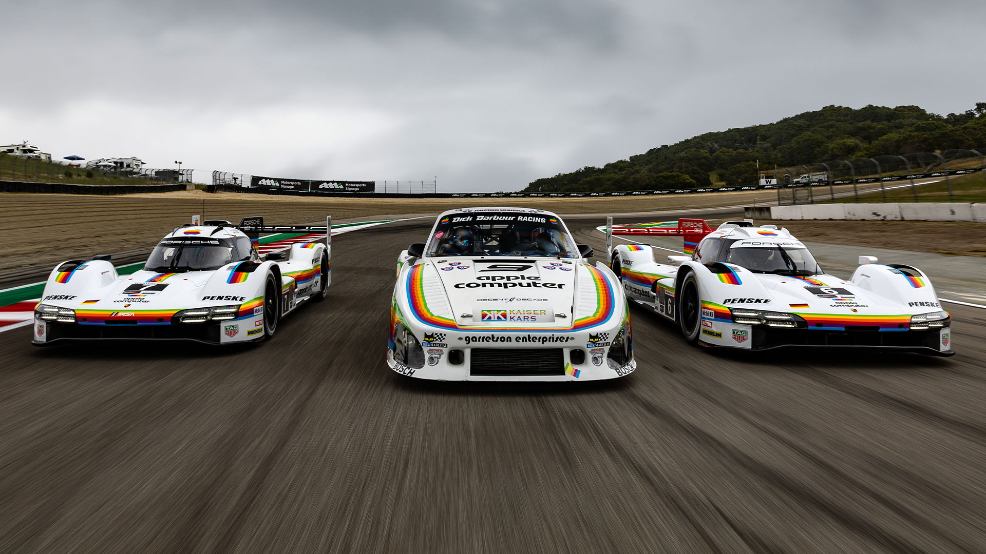 Image of Porsche Penske Motorsport 963 racecars wearing Apple Computer livery on the track at the 2026 IMSA WeatherTech Race 2